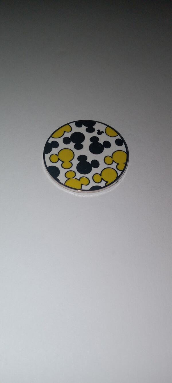 Disney silver & yellow mickey mouse ears trading pin.